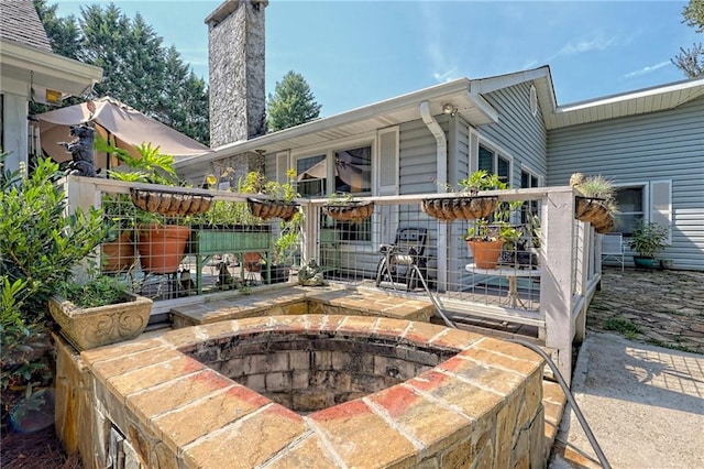 476 Franklin St, Dillard, GA 30537 - view of patio featuring a fire pit