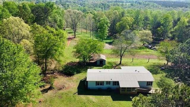 bird's eye view featuring a forest view