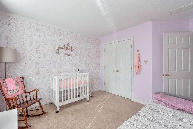 carpeted bedroom featuring a closet