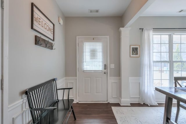 doorway featuring plenty of natural light and dark hardwood / wood-style flooring