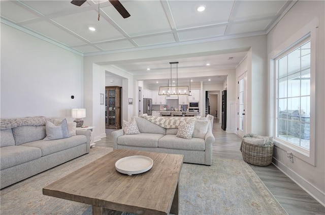 884 Oxford Rd, Ball Ground, GA 30107 - living area with coffered ceiling, light wood-type flooring, a ceiling fan, recessed lighting, and crown molding