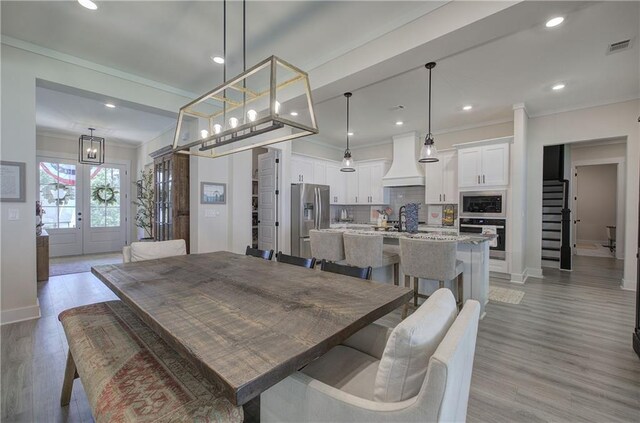 884 Oxford Rd, Ball Ground, GA 30107 - dining space with crown molding, recessed lighting, and light wood-type flooring