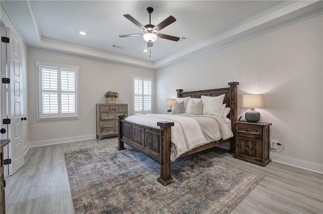 884 Oxford Rd, Ball Ground, GA 30107 - bedroom featuring a raised ceiling, light wood finished floors, ceiling fan, crown molding, and recessed lighting