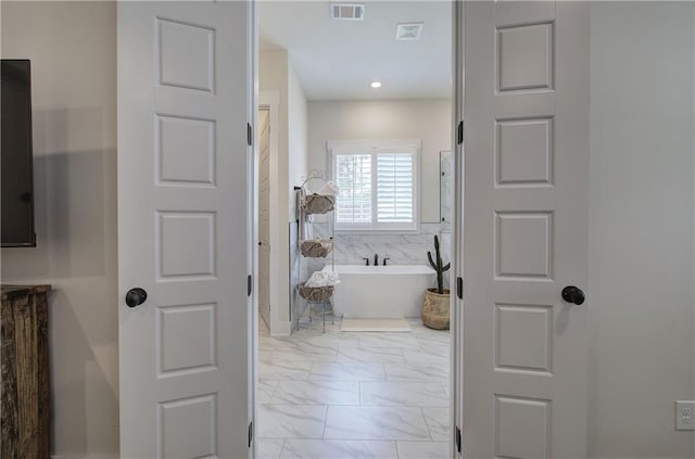 884 Oxford Rd, Ball Ground, GA 30107 - bathroom featuring marble finish floors and a soaking tub