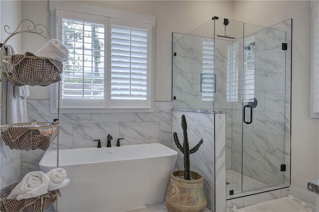 884 Oxford Rd, Ball Ground, GA 30107 - bathroom featuring a freestanding tub, a shower stall, and tile walls
