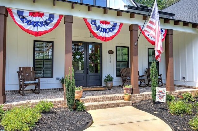 884 Oxford Rd, Ball Ground, GA 30107 - entrance to property with covered porch, board and batten siding, and french doors