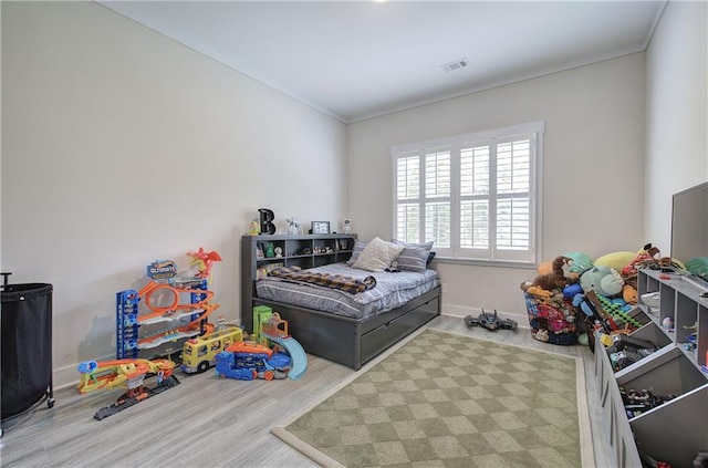 884 Oxford Rd, Ball Ground, GA 30107 - bedroom with wood finished floors and ornamental molding