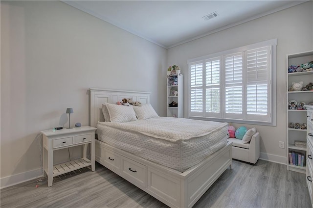 884 Oxford Rd, Ball Ground, GA 30107 - bedroom featuring light wood finished floors and ornamental molding