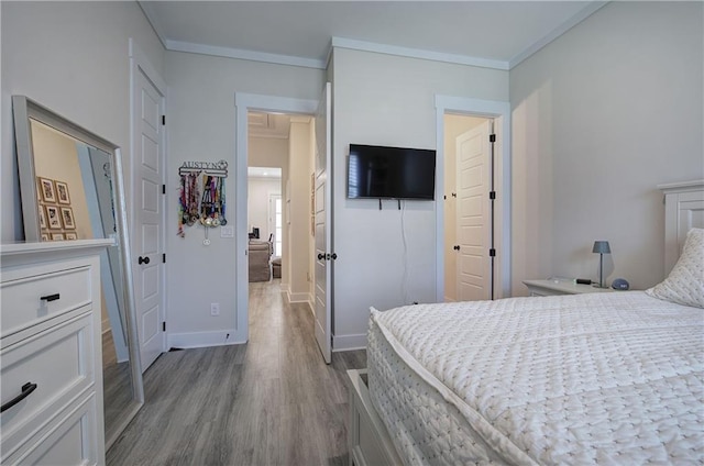 884 Oxford Rd, Ball Ground, GA 30107 - bedroom with wood finished floors and crown molding