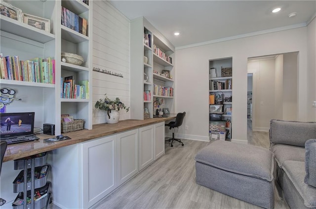 884 Oxford Rd, Ball Ground, GA 30107 - office with built in study area, ornamental molding, light wood-style flooring, and recessed lighting