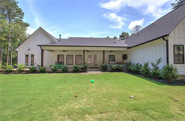884 Oxford Rd, Ball Ground, GA 30107 - view of front facade with french doors, a ceiling fan, a front lawn, and board and batten siding