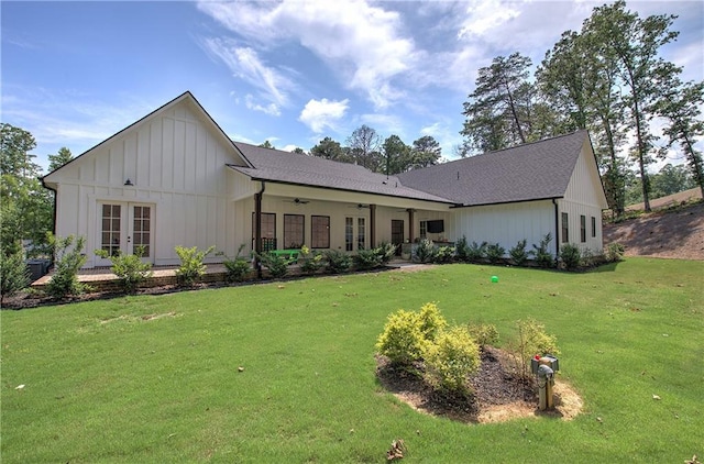 884 Oxford Rd, Ball Ground, GA 30107 - back of property featuring french doors, a ceiling fan, a lawn, and board and batten siding