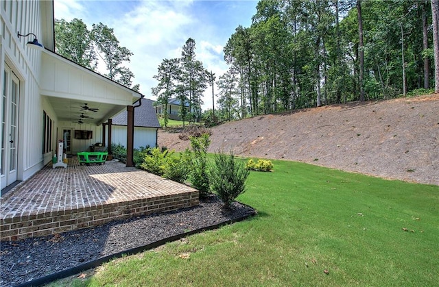 884 Oxford Rd, Ball Ground, GA 30107 - view of green lawn with a ceiling fan and a patio area