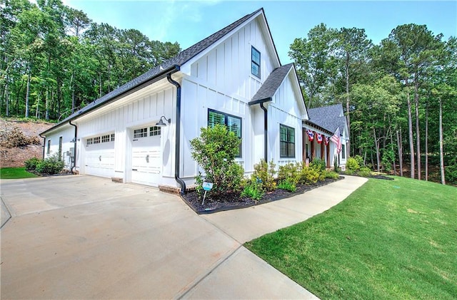 884 Oxford Rd, Ball Ground, GA 30107 - view of side of property featuring board and batten siding, a garage, concrete driveway, a yard, and roof with shingles