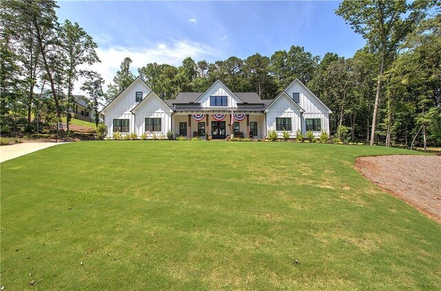884 Oxford Rd, Ball Ground, GA 30107 - modern farmhouse with board and batten siding and a front yard