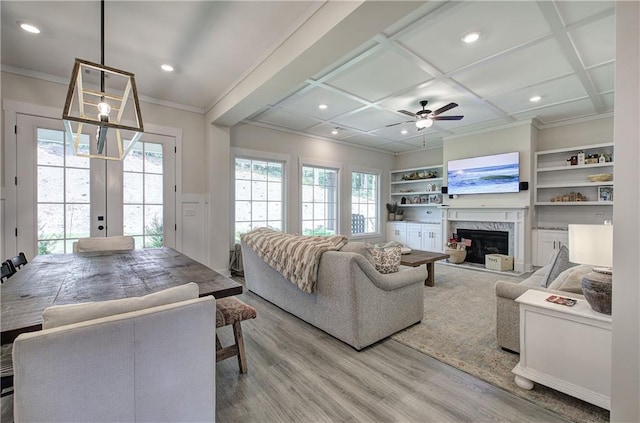 884 Oxford Rd, Ball Ground, GA 30107 - living area with wood finished floors, a high end fireplace, ornamental molding, a ceiling fan, and recessed lighting