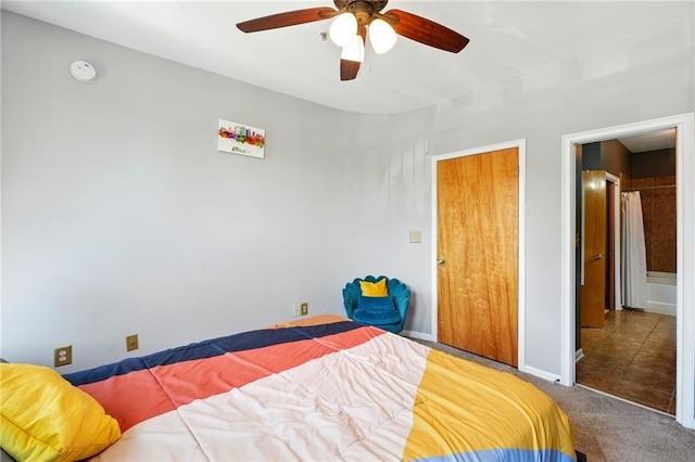 carpeted bedroom featuring a ceiling fan and baseboards