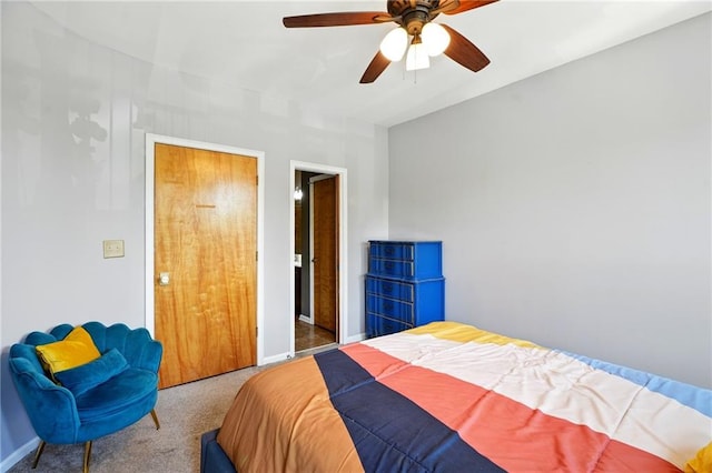 bedroom with carpet floors, a ceiling fan, and baseboards