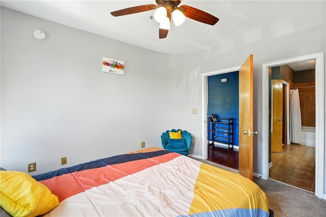 carpeted bedroom with baseboards and ceiling fan