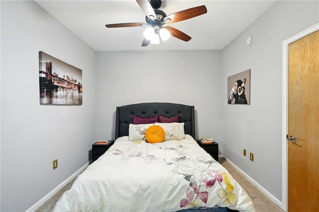 bedroom featuring baseboards, ceiling fan, and carpet floors