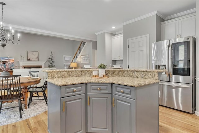 809 Hillcrest Ln, Woodstock, GA 30189 - kitchen featuring stainless steel refrigerator with ice dispenser, gray cabinets, crown molding, white cabinets, and light wood finished floors