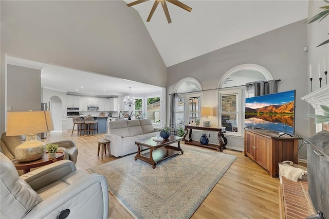 809 Hillcrest Ln, Woodstock, GA 30189 - living area featuring high vaulted ceiling, ceiling fan, arched walkways, and light wood finished floors
