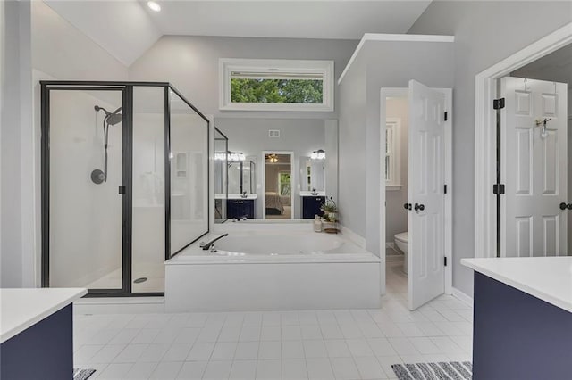 809 Hillcrest Ln, Woodstock, GA 30189 - bathroom with lofted ceiling, a garden tub, a shower stall, toilet, and vanity