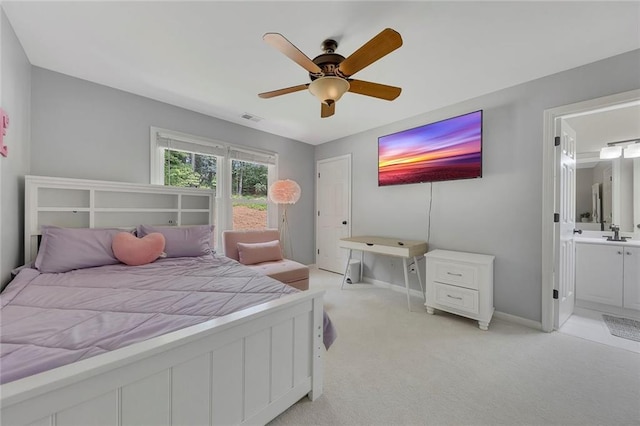 809 Hillcrest Ln, Woodstock, GA 30189 - bedroom featuring light carpet, baseboards, ceiling fan, connected bathroom, and a sink