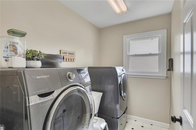 809 Hillcrest Ln, Woodstock, GA 30189 - laundry room with washer and clothes dryer, baseboards, and healthy amount of natural light