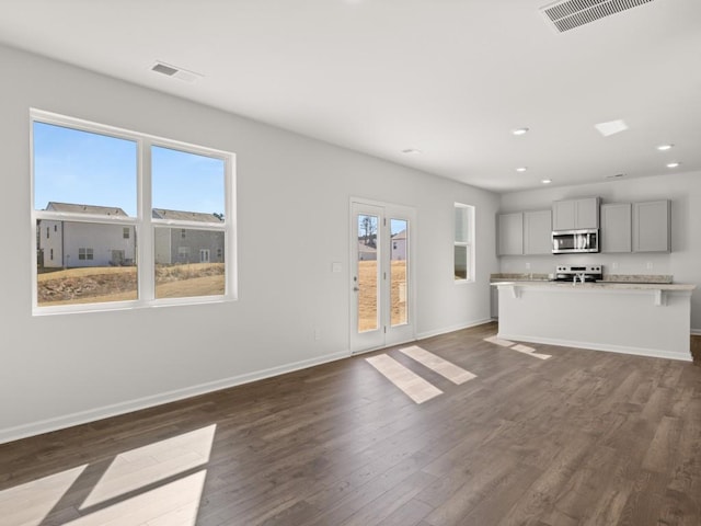 13 Coggins Pl, Rome, GA 30165 - unfurnished living room with recessed lighting, baseboards, and dark wood finished floors