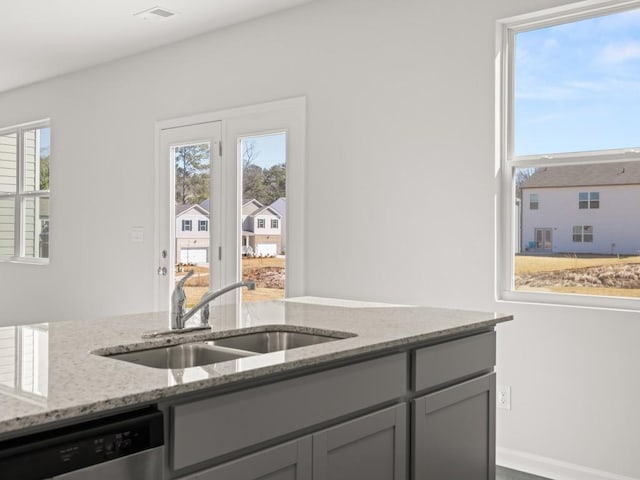 13 Coggins Pl, Rome, GA 30165 - kitchen with a sink, stainless steel dishwasher, light stone countertops, and gray cabinetry