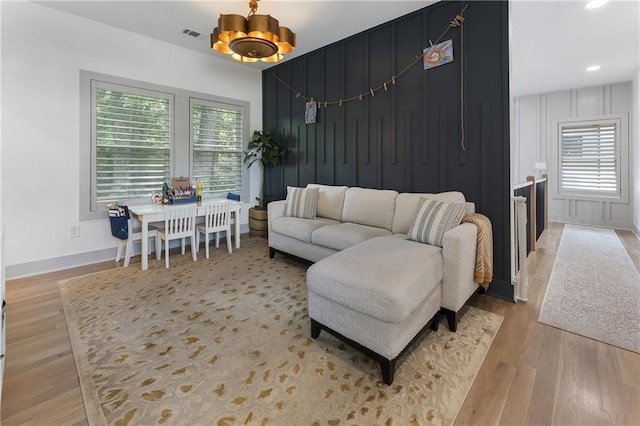 3899 Carlton Dr, Chamblee, GA 30341 - living room with wood finished floors, recessed lighting, and a chandelier