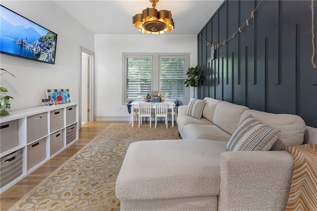 3899 Carlton Dr, Chamblee, GA 30341 - living room featuring a chandelier and wood finished floors