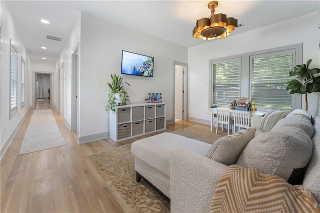 3899 Carlton Dr, Chamblee, GA 30341 - living room featuring healthy amount of natural light, light wood-style floors, and recessed lighting