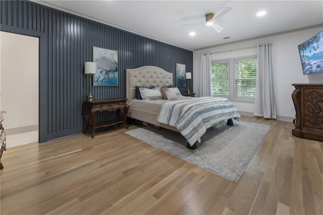 3899 Carlton Dr, Chamblee, GA 30341 - bedroom with light wood-type flooring, ornamental molding, a ceiling fan, recessed lighting, and an accent wall