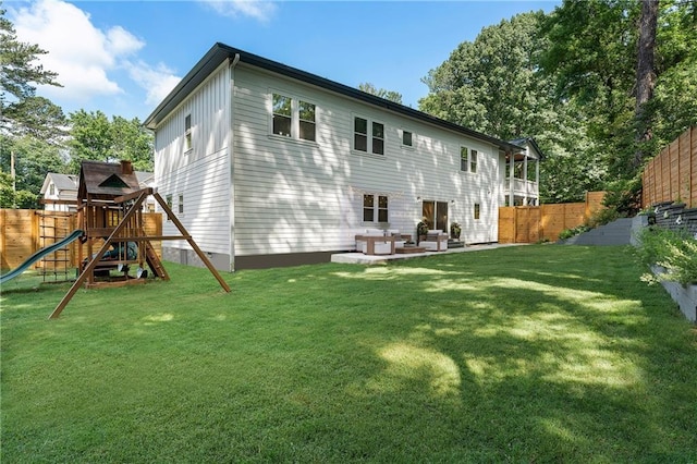 3899 Carlton Dr, Chamblee, GA 30341 - back of house with a playground, a fenced backyard, and a patio