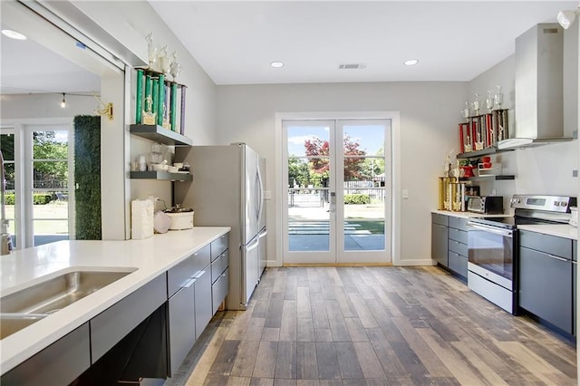 3899 Carlton Dr, Chamblee, GA 30341 - kitchen featuring stainless steel appliances, open shelves, gray cabinetry, light wood-style flooring, and french doors