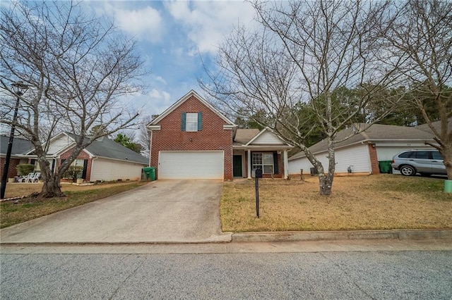 traditional-style home featuring a garage, concrete driveway, and brick siding