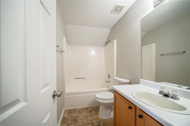 bathroom featuring visible vents, toilet, washtub / shower combination, a textured ceiling, and vanity