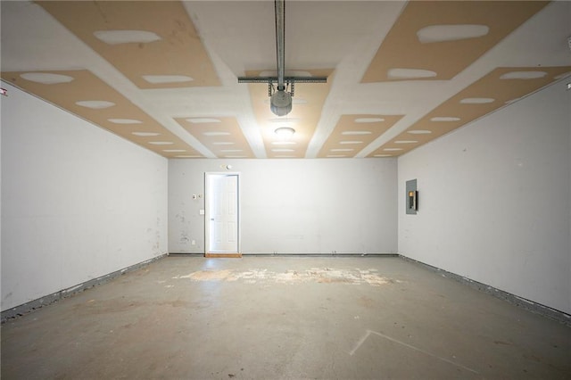 interior space featuring electric panel and concrete floors