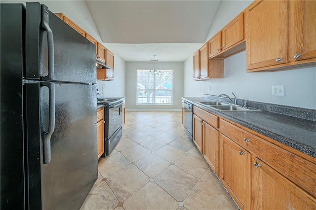 kitchen featuring lofted ceiling, under cabinet range hood, a sink, black appliances, and dark countertops