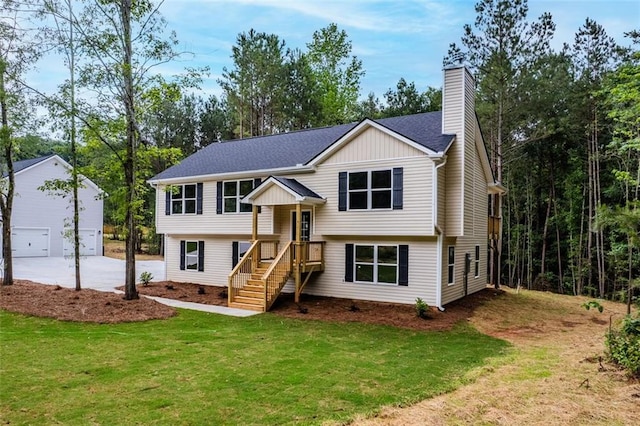 5209 Waterworks Rd, Jefferson, GA 30549 - bi-level home featuring a detached garage, a chimney, a front yard, and an outbuilding