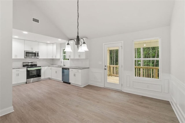 5209 Waterworks Rd, Jefferson, GA 30549 - kitchen with appliances with stainless steel finishes, a sink, plenty of natural light, pendant lighting, and wainscoting