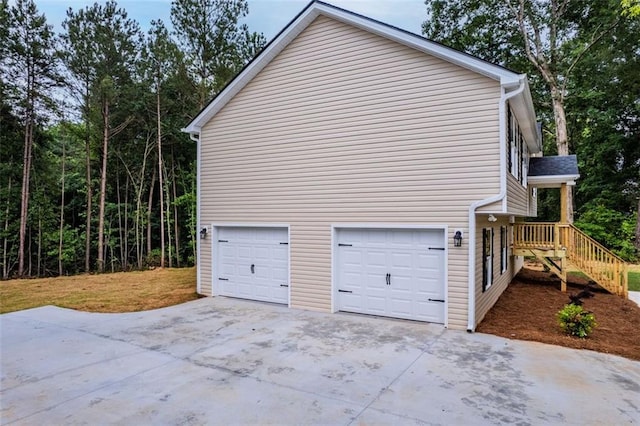 5209 Waterworks Rd, Jefferson, GA 30549 - view of side of property with driveway and an attached garage