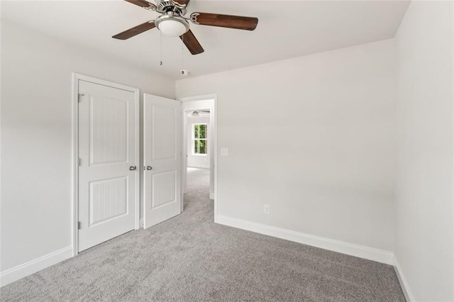 5209 Waterworks Rd, Jefferson, GA 30549 - unfurnished bedroom featuring carpet floors, baseboards, a ceiling fan, and a closet