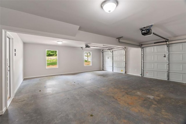 5209 Waterworks Rd, Jefferson, GA 30549 - garage featuring baseboards and a garage door opener
