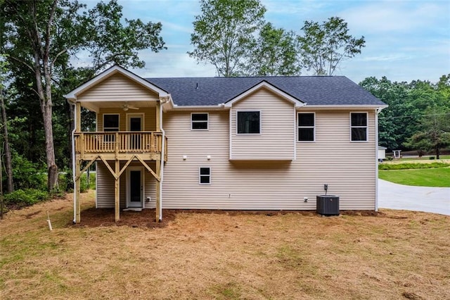 5209 Waterworks Rd, Jefferson, GA 30549 - back of property featuring a ceiling fan, a lawn, cooling unit, a shingled roof, and a wooden deck