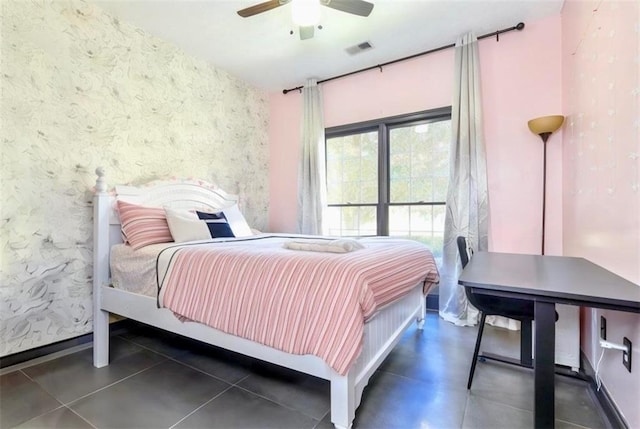 bedroom with visible vents, ceiling fan, baseboards, and wallpapered walls