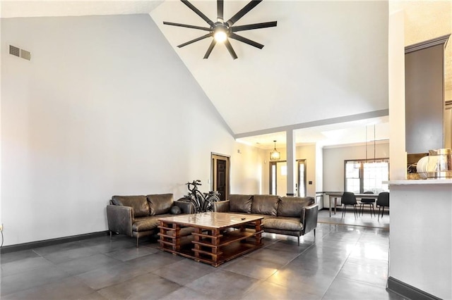 living area featuring high vaulted ceiling, baseboards, visible vents, and ceiling fan