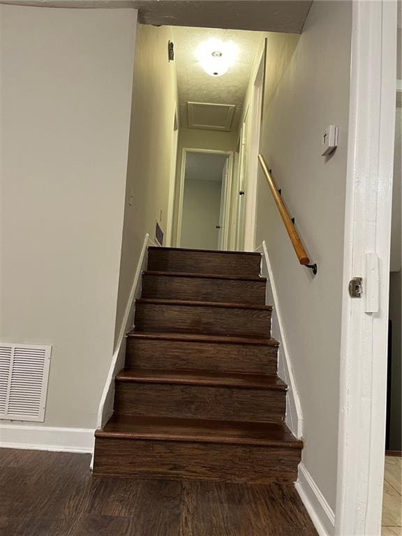 stairs with hardwood / wood-style flooring